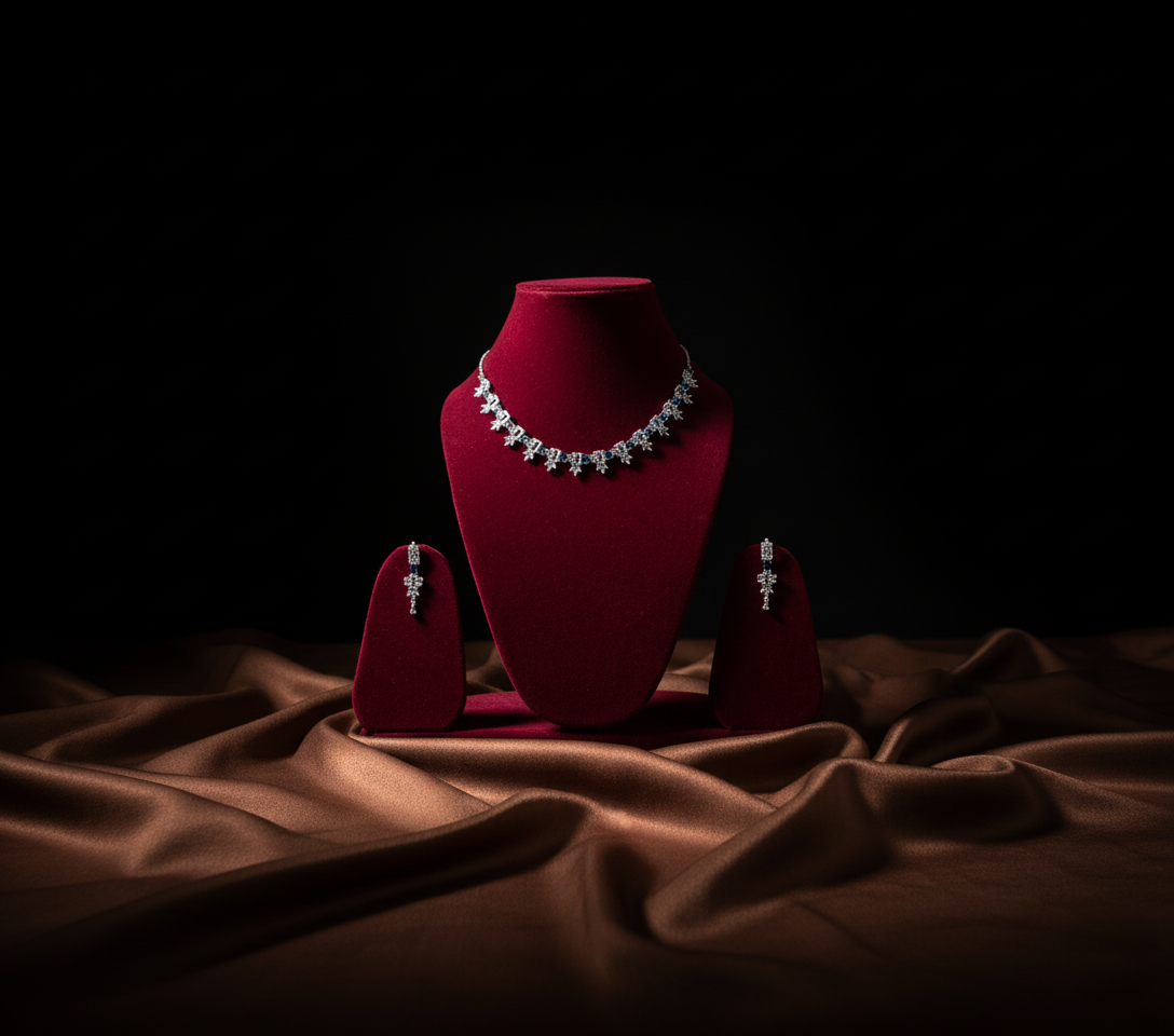 Jewelry set on a red velvet stand with a dark background