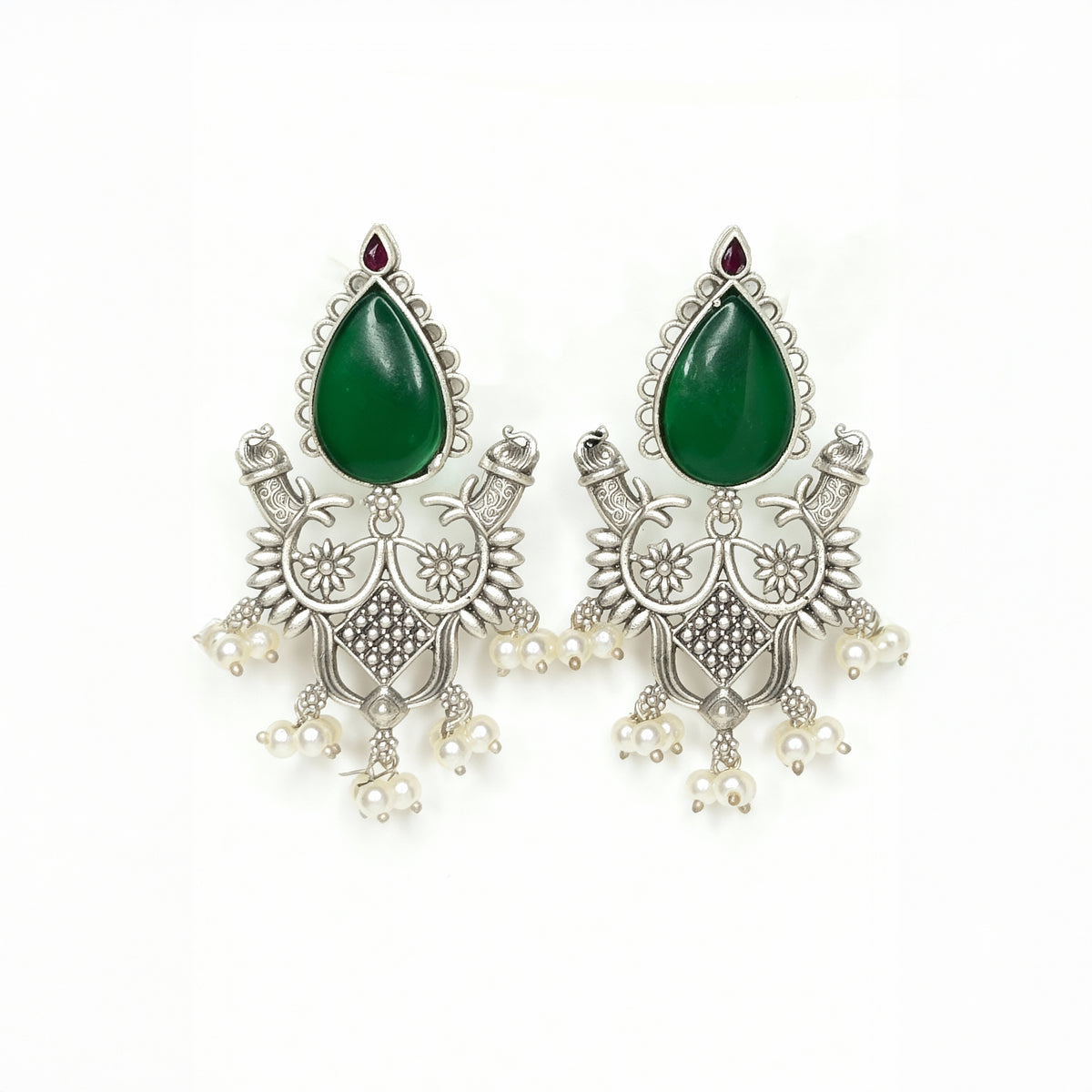 Pair of silver earrings with green teardrop stones on a white background