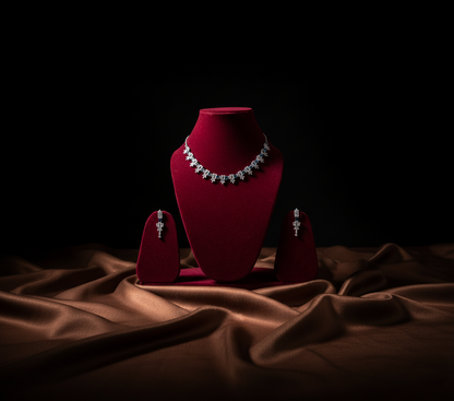 Jewelry set on a red velvet stand with a dark background