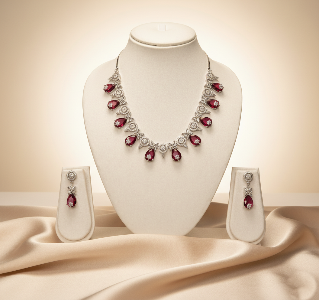 Jewelry set with necklace and earrings on a mannequin bust against a beige background