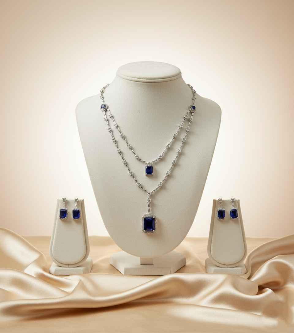 Jewelry set with necklace and earrings on a mannequin bust against a beige background