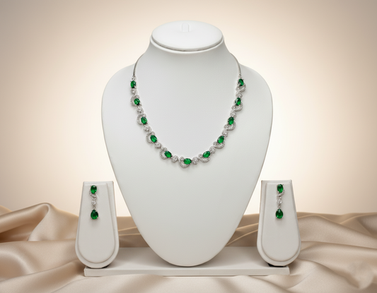 Jewelry set with necklace and earrings on a white mannequin bust against a beige background