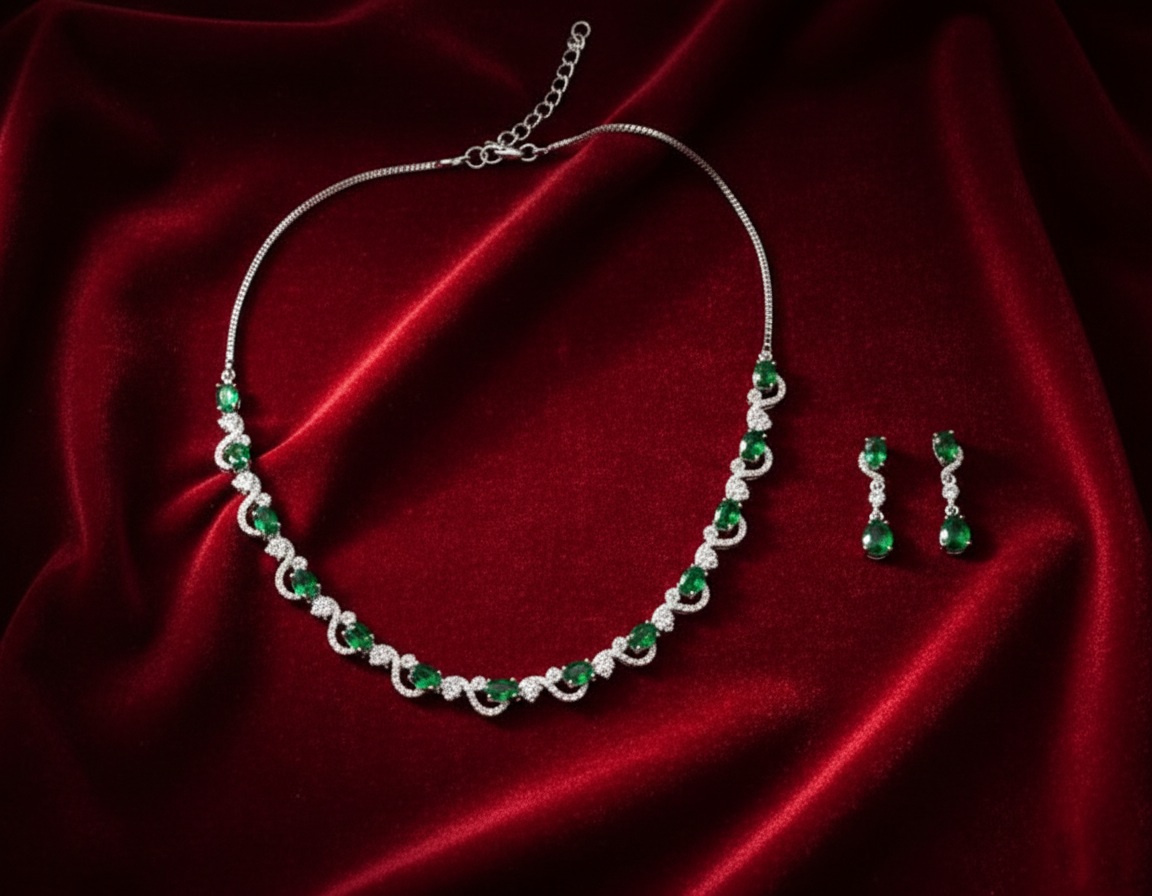 Jewelry set with necklace and earrings on red fabric