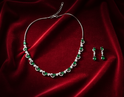 Jewelry set with necklace and earrings on red fabric